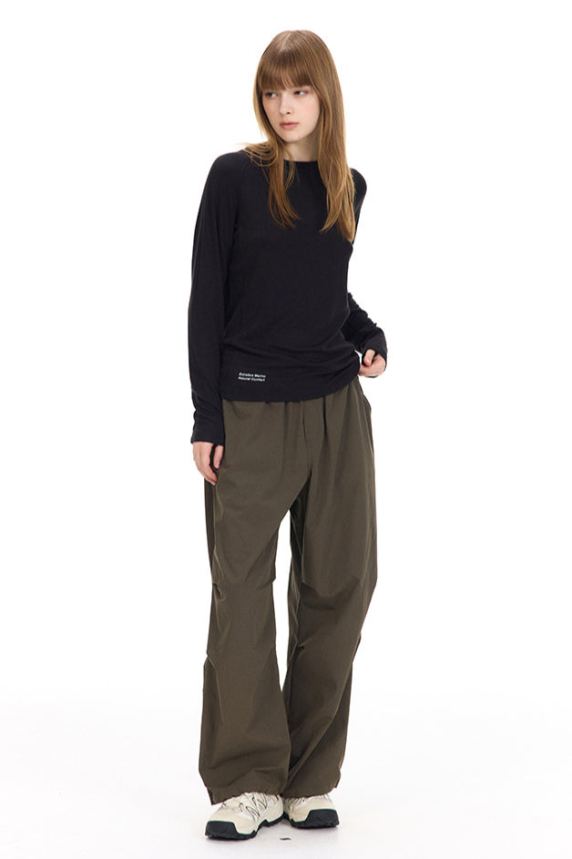 Pullover lungo nero con scollo a V da donna