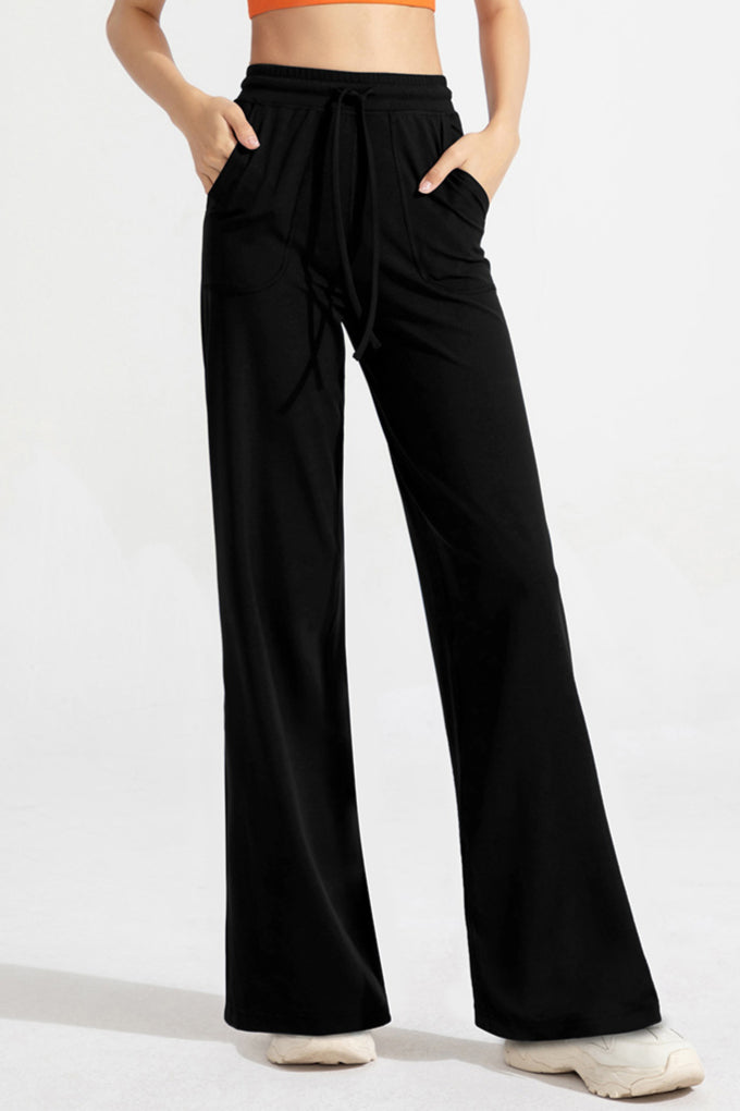 Pantaloni classici a zampa con coulisse da donna