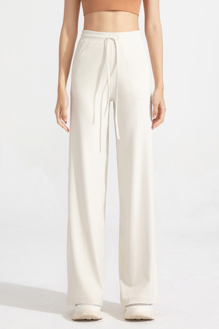 Pantaloni classici a zampa con coulisse da donna