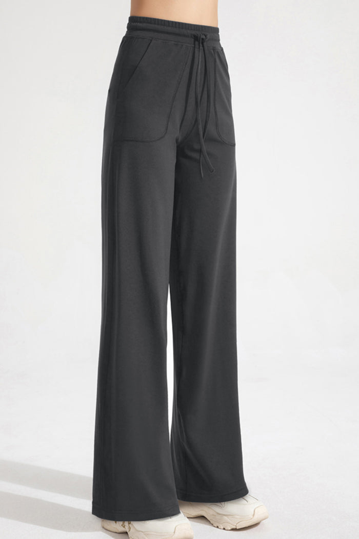 Pantaloni classici a zampa con coulisse da donna