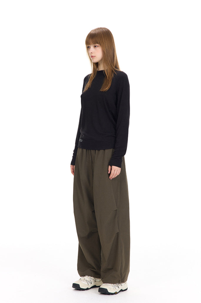 Pullover lungo nero con scollo a V da donna
