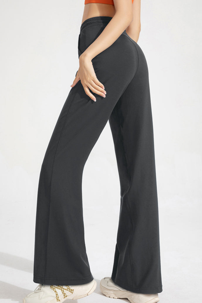 Pantaloni classici a zampa con coulisse da donna