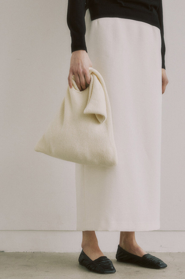 Elegante borsa tote in maglia color crema minimalista